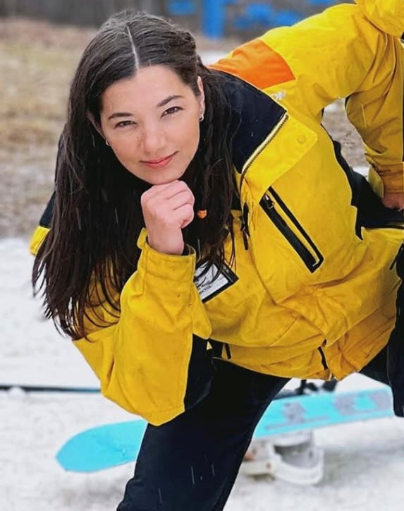 Women with yellow jacket posing