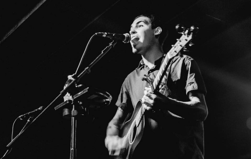 Guys singing with mic and guitar